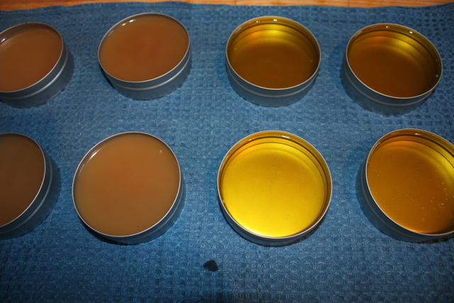 Final ointments cooling in their tins.  The brown is the anti-viral and the bright yellow is for hotspots.